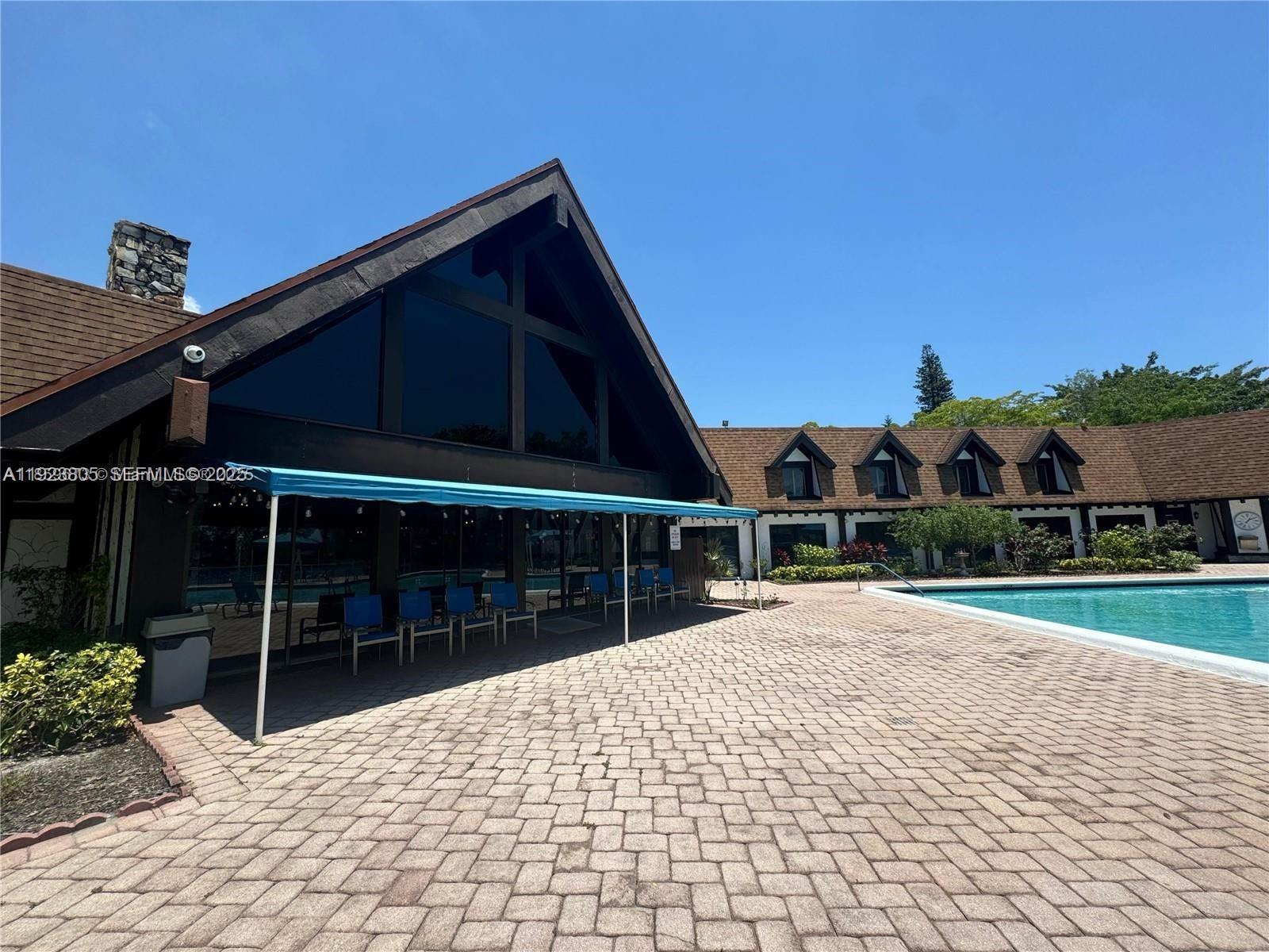 3720 Inverrary Drive, Unit 1S Lauderhill, FL 33319 - Photo 7 of 25 a view of house with yard