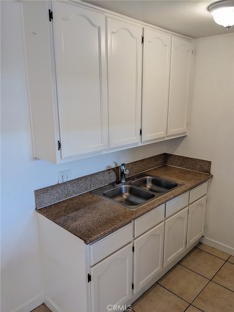 1708 Pine Avenue, Unit 11 Long Beach, CA 90813 - Photo 6 of 17 a kitchen with a sink and cabinets