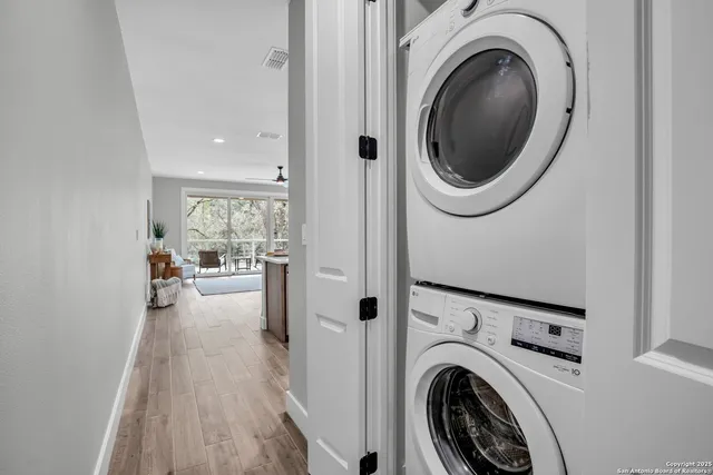 a view of a hallway with washer and dryer