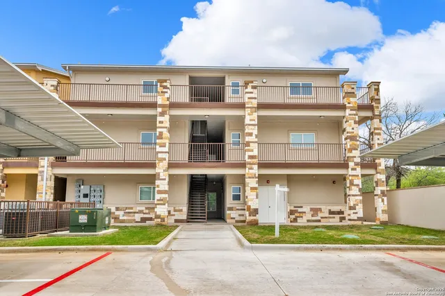 a front view of building with yard