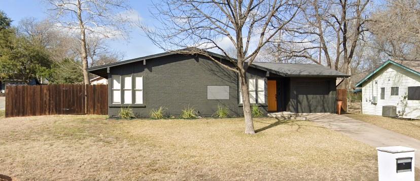 View of side of property with brick siding and a central AC unit