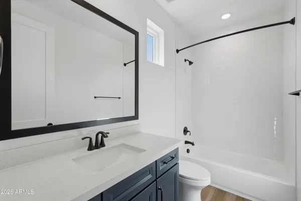 a room with a dresser and a mirror