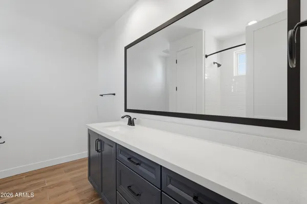 a room with wooden floor and cabinet