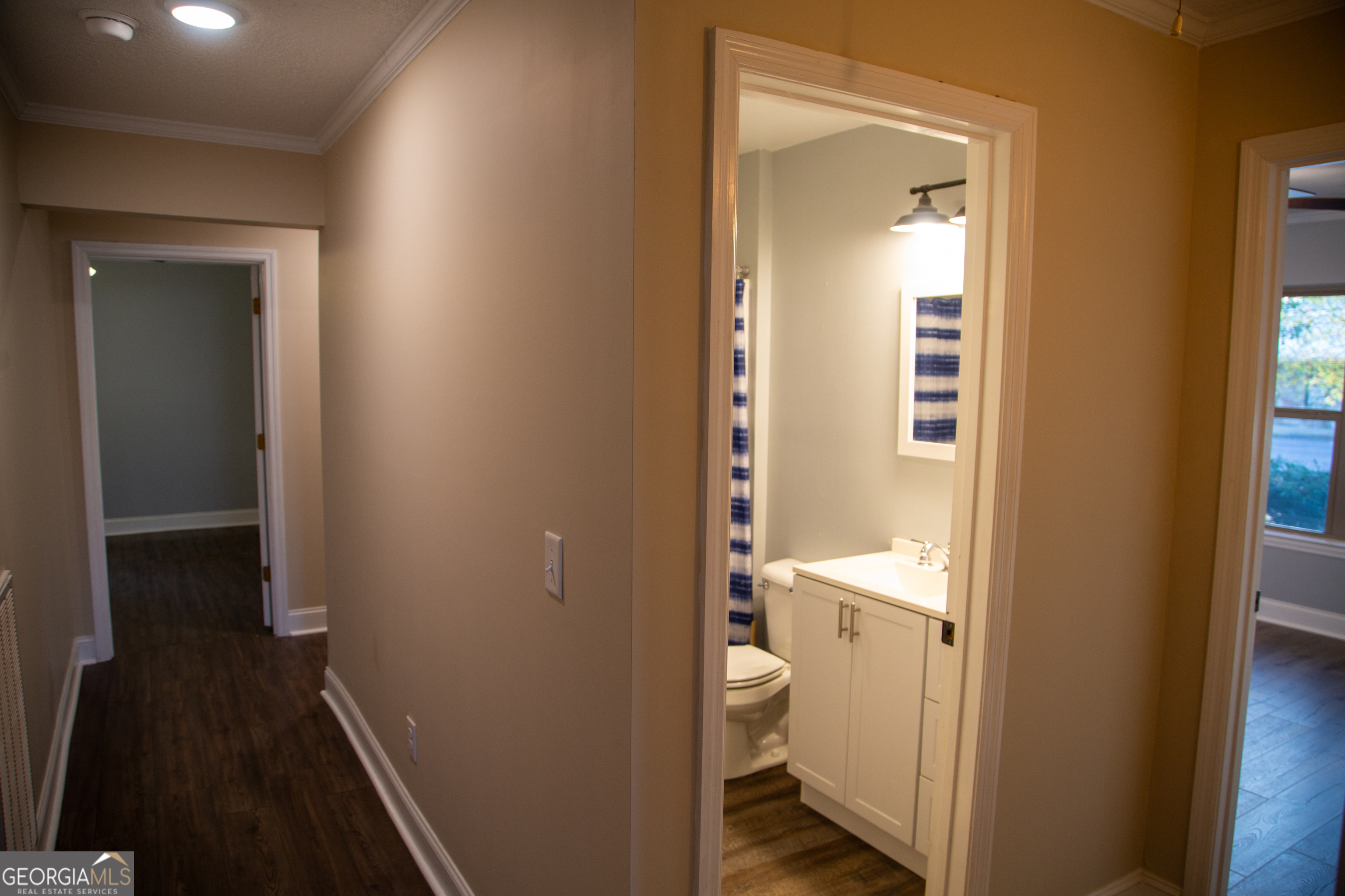 307 South Duke Street LaFayette, GA 30728 - Photo 13 of 23 a bathroom with a granite countertop toilet and a sink