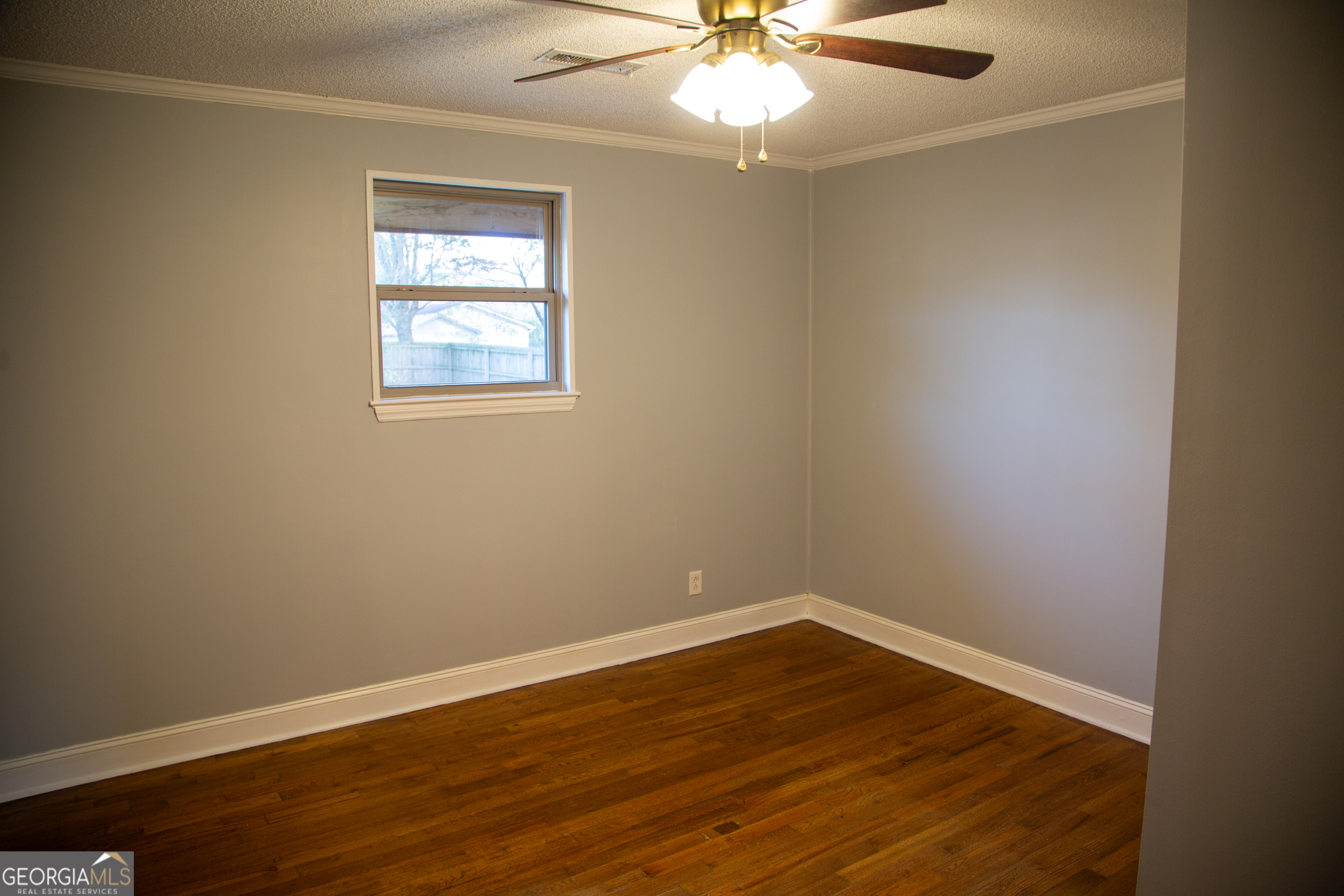 307 South Duke Street LaFayette, GA 30728 - Photo 14 of 23 wooden floor in an empty room with a window
