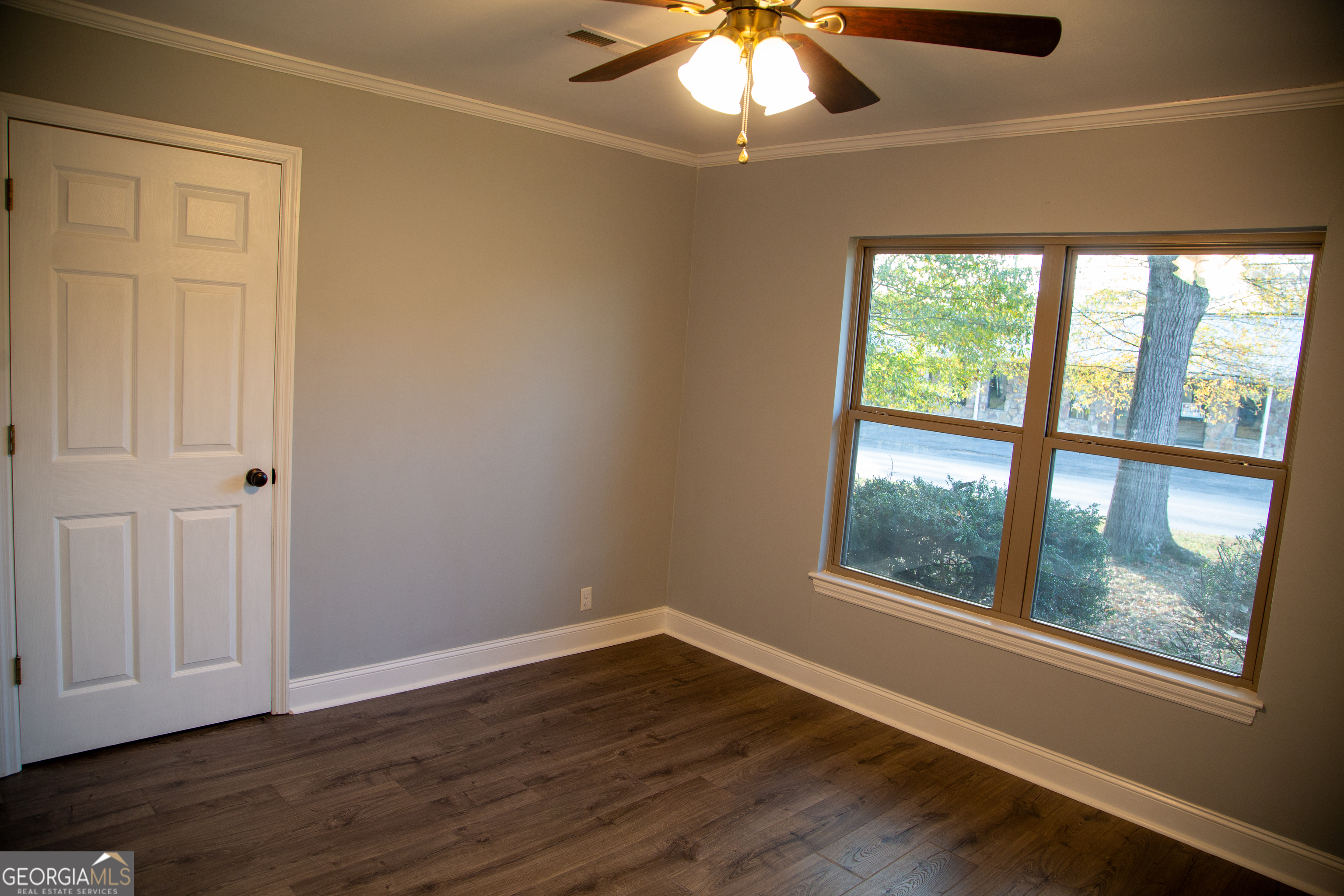 307 South Duke Street LaFayette, GA 30728 - Photo 17 of 23 an empty room with wooden floor and windows