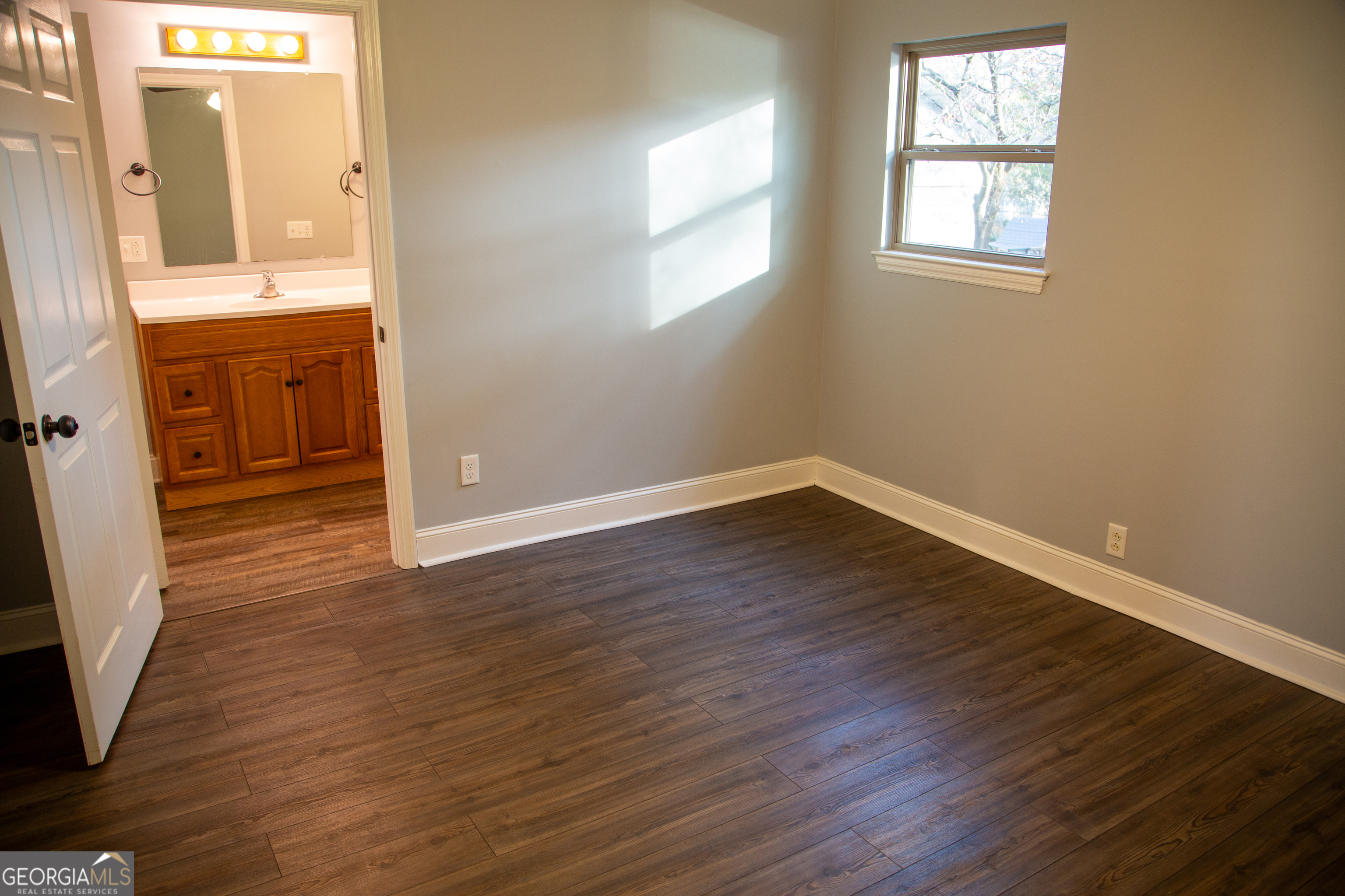 307 South Duke Street LaFayette, GA 30728 - Photo 21 of 23 an empty room with wooden floor and windows