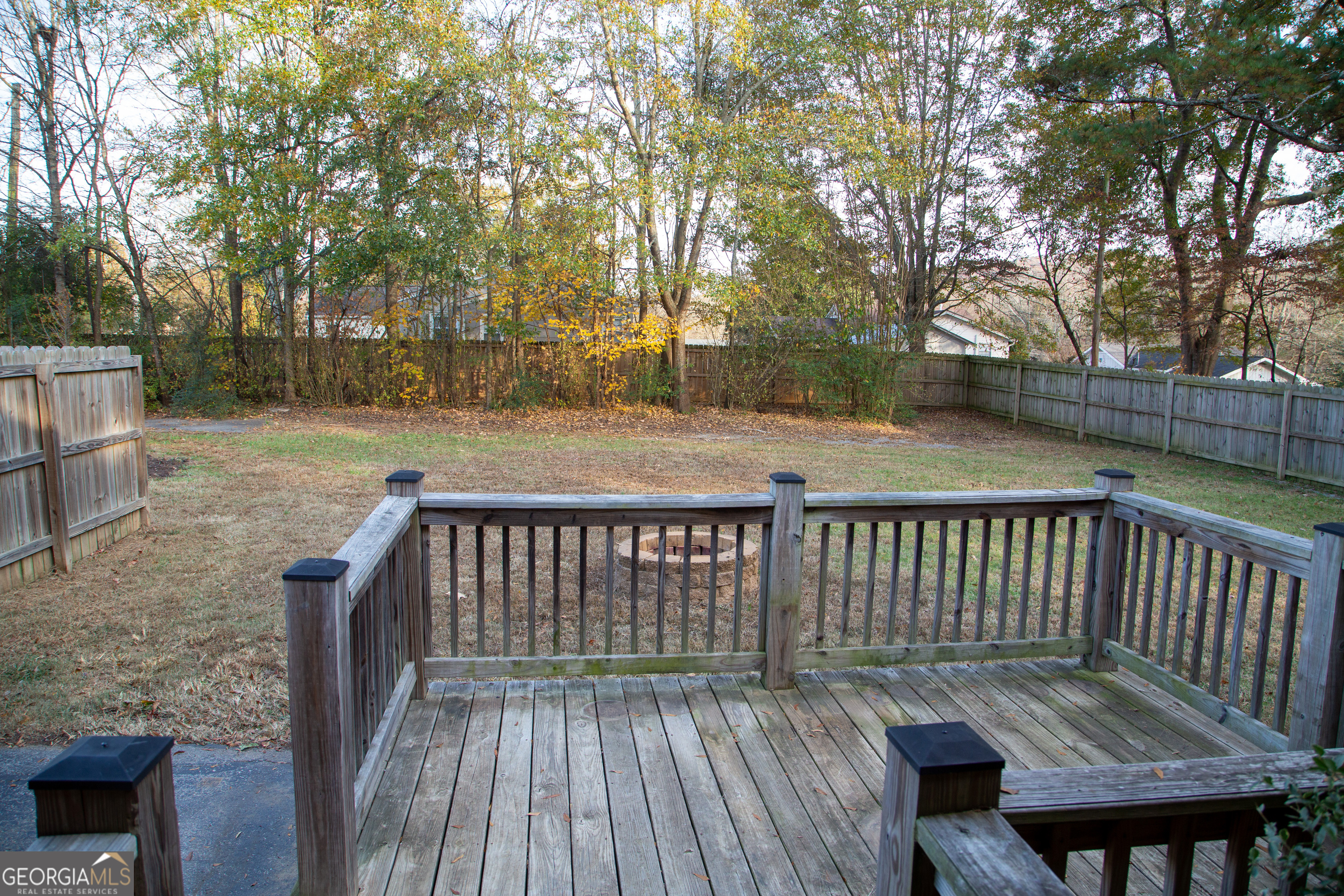 307 South Duke Street LaFayette, GA 30728 - Photo 4 of 23 a view of balcony with wooden floor and fence