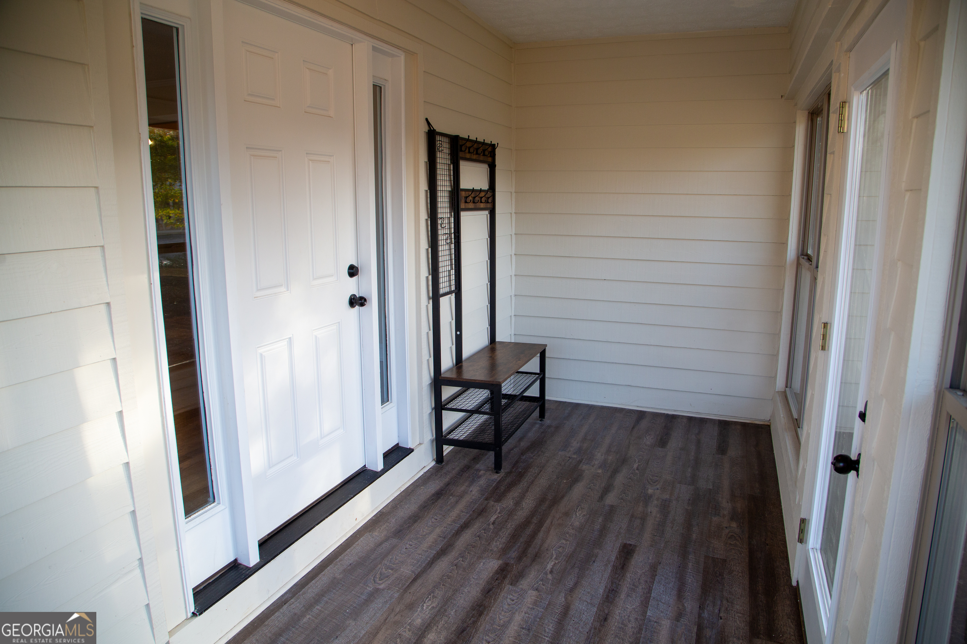 307 South Duke Street LaFayette, GA 30728 - Photo 7 of 23 a view of a hallway with wooden floor and a bathroom