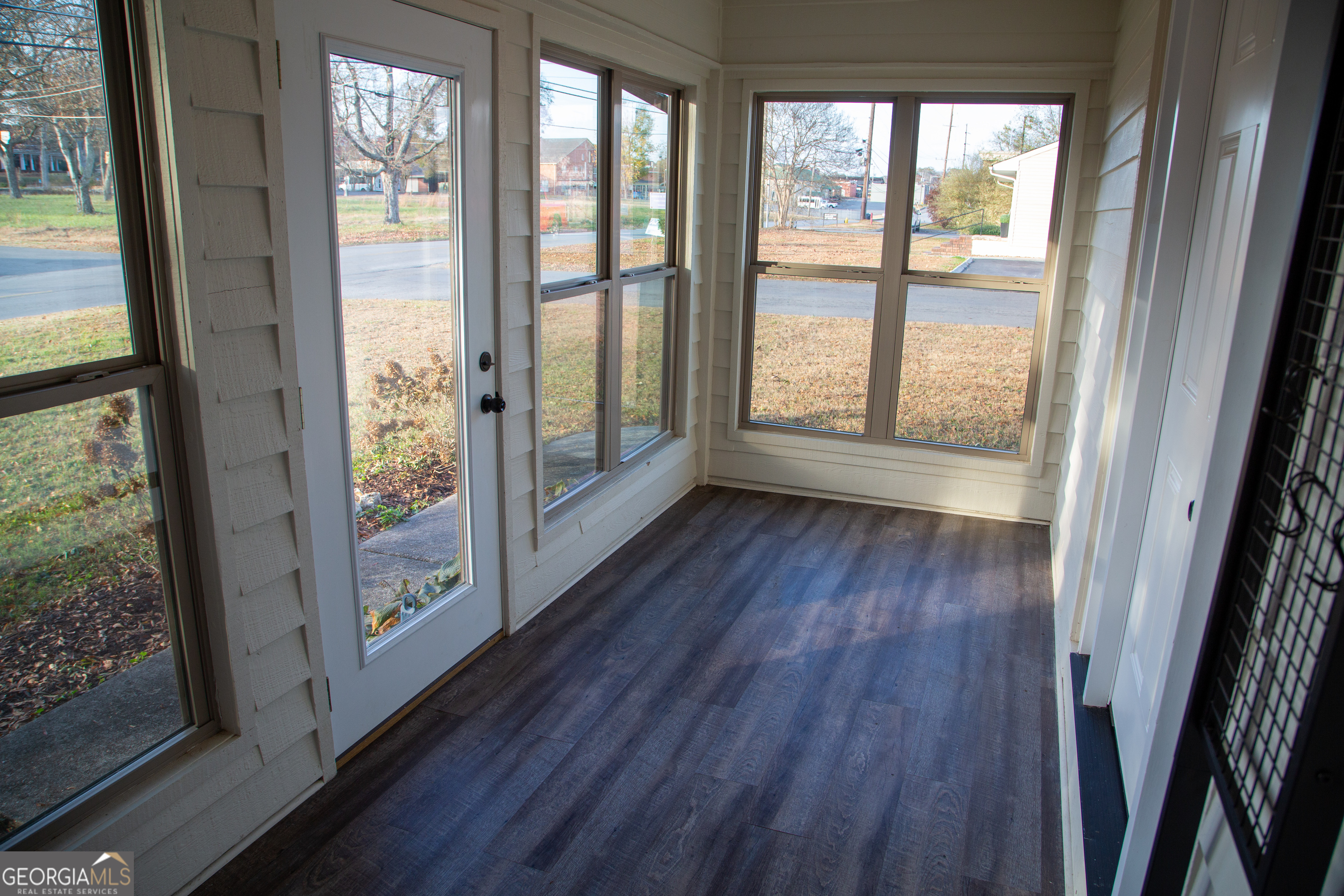 307 South Duke Street LaFayette, GA 30728 - Photo 8 of 23 a view of a hallway with wooden floor and windows