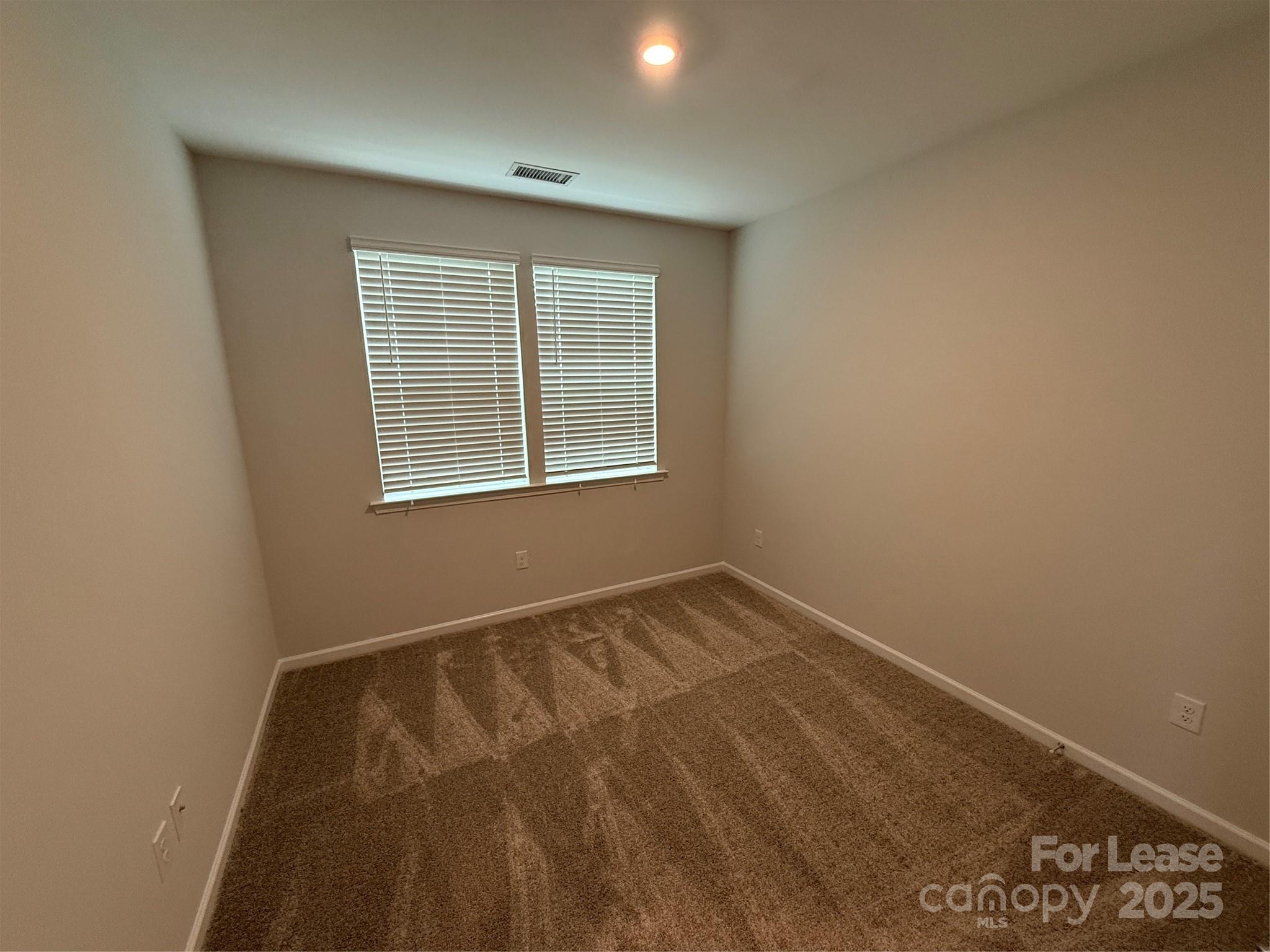 4455 Reed Crk Drive, Unit 101 Sherrills Ford, NC 28673 - Photo 21 of 34 a view of an empty room with a window