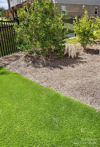 a backyard of a house with lots of green space
