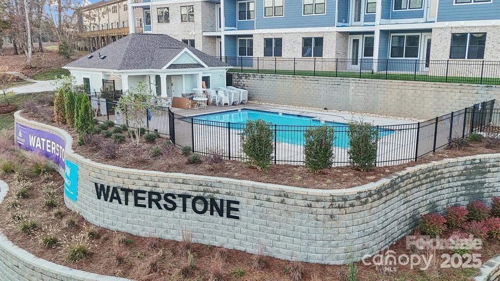 4455 Reed Crk Drive, Unit 101 Sherrills Ford, NC 28673 - Photo 27 of 34 a building with river in front of it
