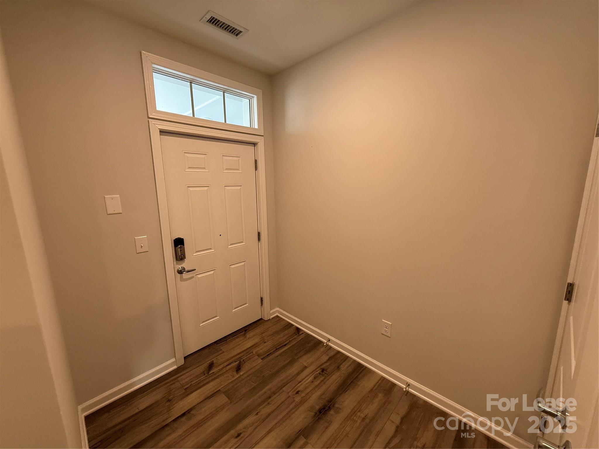 4455 Reed Crk Drive, Unit 101 Sherrills Ford, NC 28673 - Photo 3 of 34 wooden floor and cabinet in a room