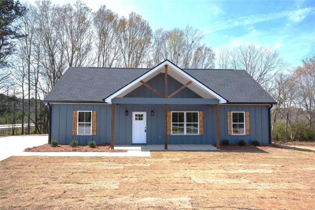 152 Addie Jane Lane Buchanan, GA 30113 - Photo 1 of 28 a house that has a tree in front of it