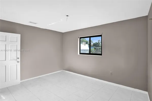 a view of empty room with windows