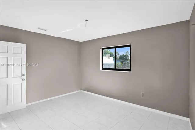 a view of empty room with windows