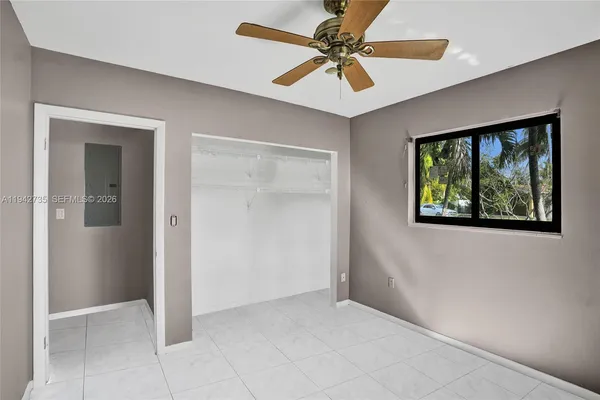 a view of an empty room with a window