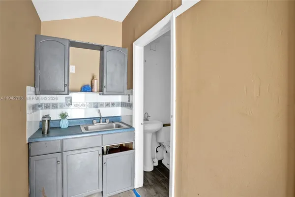 a bathroom with a sink and a mirror