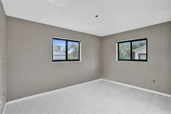 a view of empty room with windows