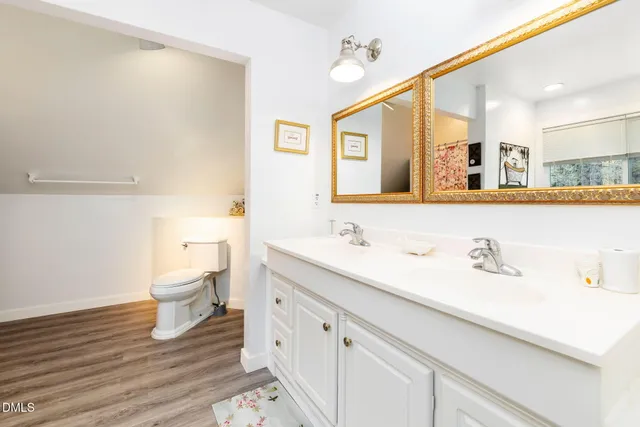 a view of a chairs and table in the balcony