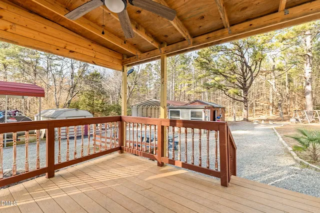 a view of a house with patio furniture and a fire pit