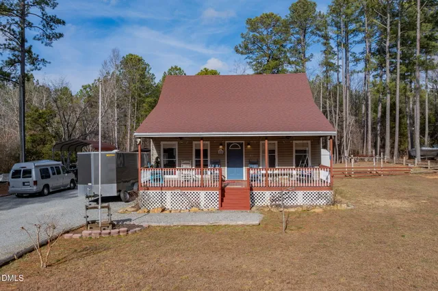 a view of a patio with table and chairs and potted plants