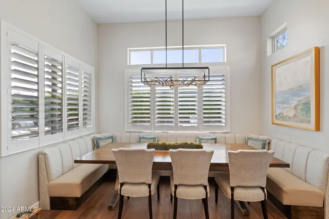 a dining room with furniture and window