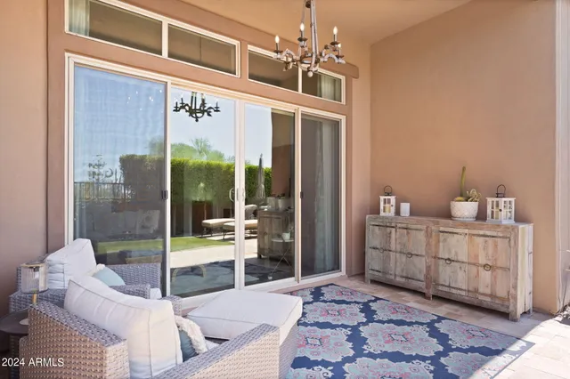 a view of a livingroom with furniture and windows