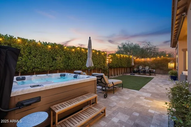 a view of a patio with a table and chairs