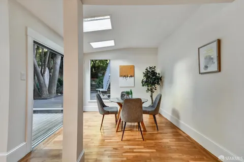 a workspace room with furniture and wooden floor
