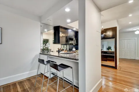 a view of a kitchen and dining room