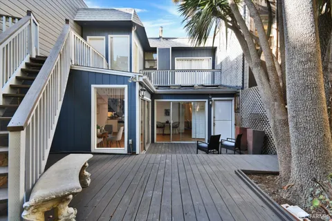 a view of a house with a large window and wooden floor
