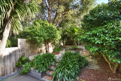 a backyard of a house with lots of green space