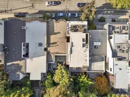 aerial view of residential houses with outdoor space
