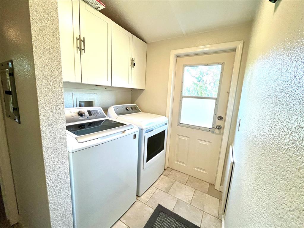 4008 77th Boulevard Jasper, FL 32052 - Photo 12 of 35 a utility room with wooden floor washer and dryer