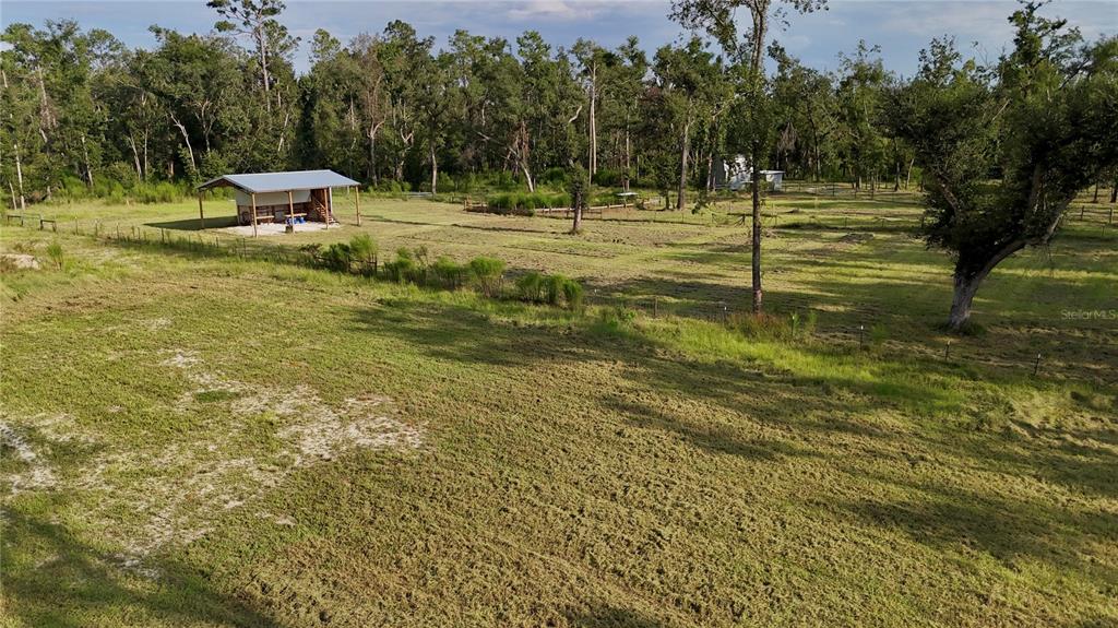 4008 77th Boulevard Jasper, FL 32052 - Photo 17 of 35 a garden view with a bench