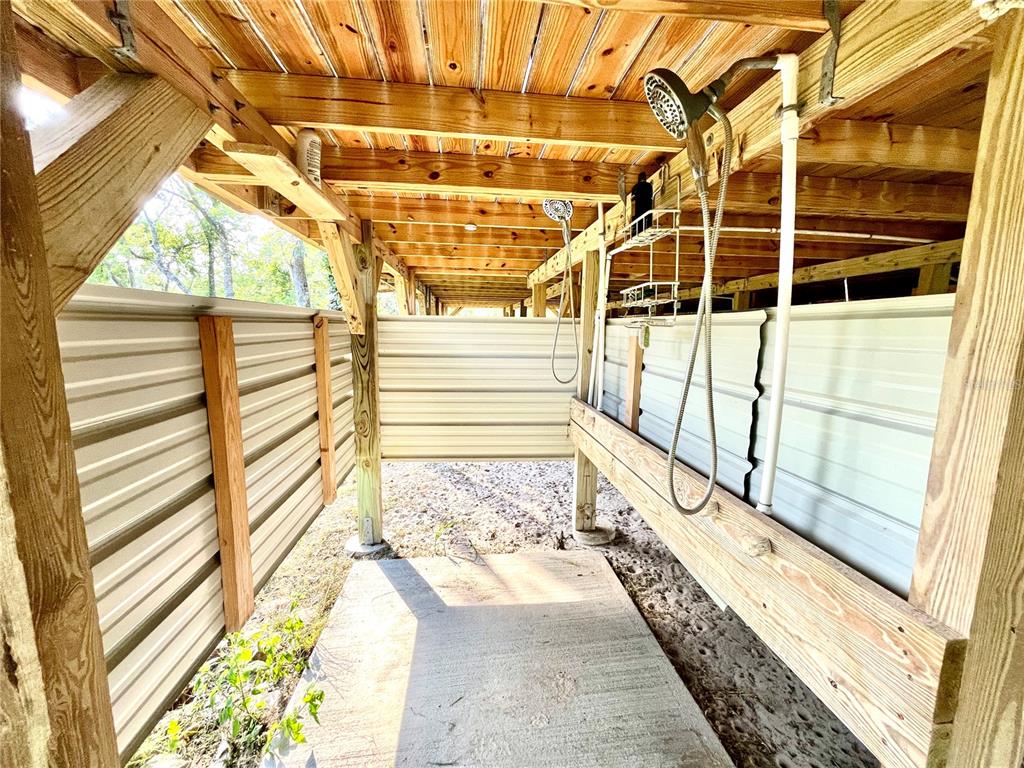 4008 77th Boulevard Jasper, FL 32052 - Photo 25 of 35 a view of a balcony with wooden floor and door