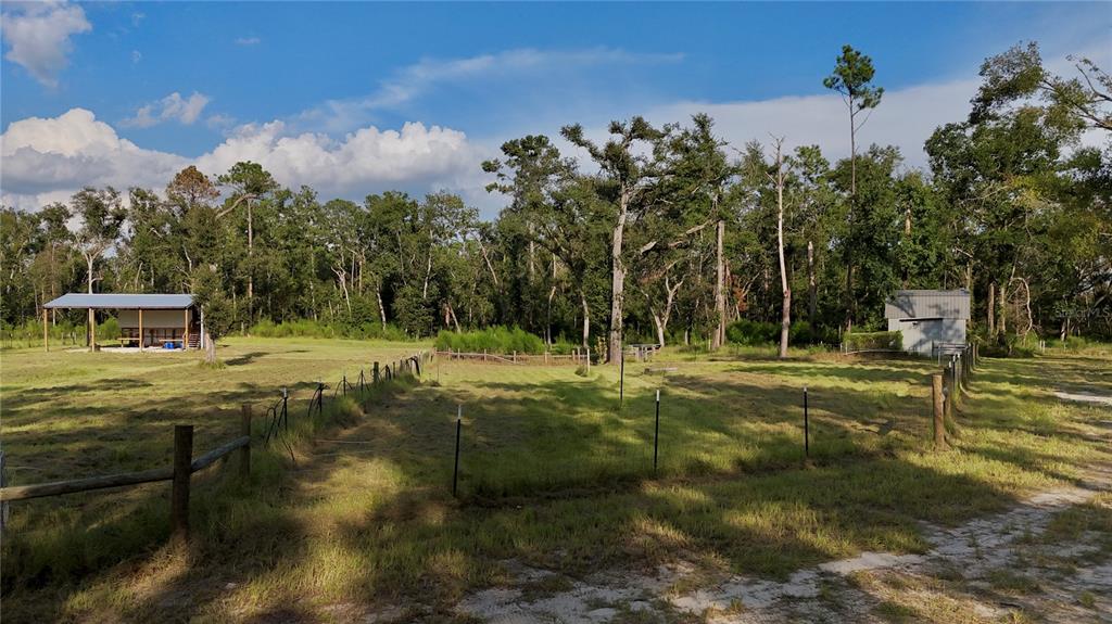 4008 77th Boulevard Jasper, FL 32052 - Photo 34 of 35 a view of a fountain in the backyard of a house