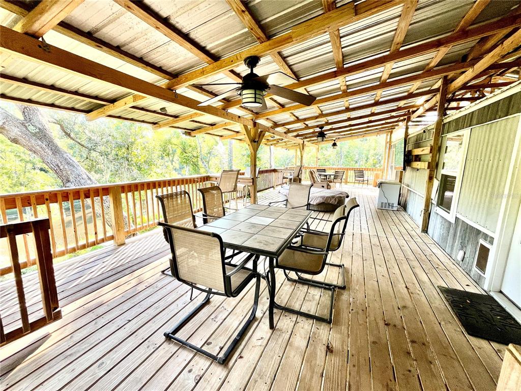 4008 77th Boulevard Jasper, FL 32052 - Photo 6 of 35 a view of two chairs in the balcony