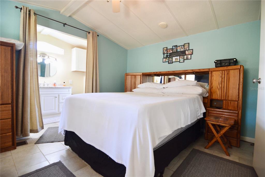 4008 77th Boulevard Jasper, FL 32052 - Photo 7 of 35 a bed sitting in a bedroom next to a window