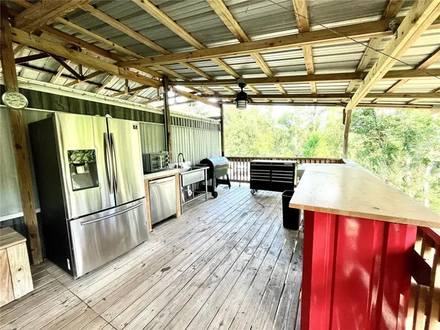 a bathroom with a granite countertop sink a mirror a vanity and shower