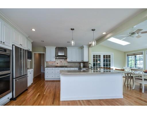 33 Chestnut Street Wellesley, MA 02481 - Photo 3 of 17 a kitchen with stainless steel appliances granite countertop a sink refrigerator and cabinets