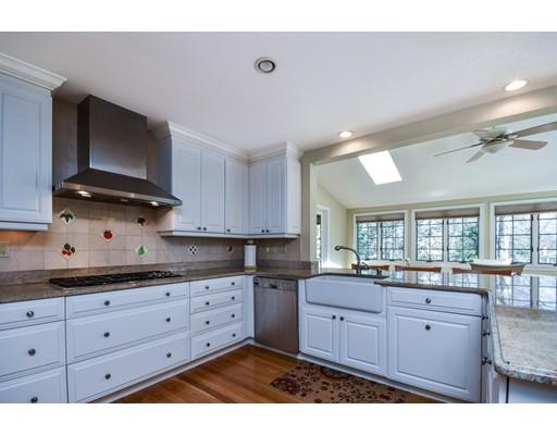 33 Chestnut Street Wellesley, MA 02481 - Photo 4 of 17 a kitchen with granite countertop a sink cabinets and stainless steel appliances