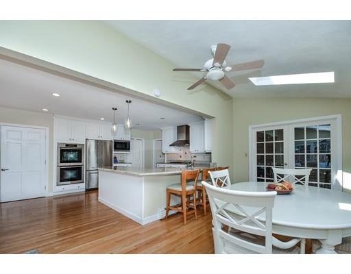 33 Chestnut Street Wellesley, MA 02481 - Photo 5 of 17 a living room with kitchen island furniture and a kitchen view