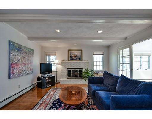 33 Chestnut Street Wellesley, MA 02481 - Photo 7 of 17 a living room with furniture a fireplace and a flat screen tv