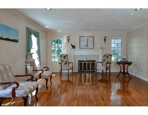 33 Chestnut Street Wellesley, MA 02481 - Photo 8 of 17 a living room with furniture dining table and a wooden floor
