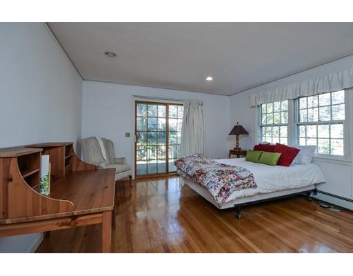 33 Chestnut Street Wellesley, MA 02481 - Photo 10 of 17 a bedroom with a bed and wooden floor