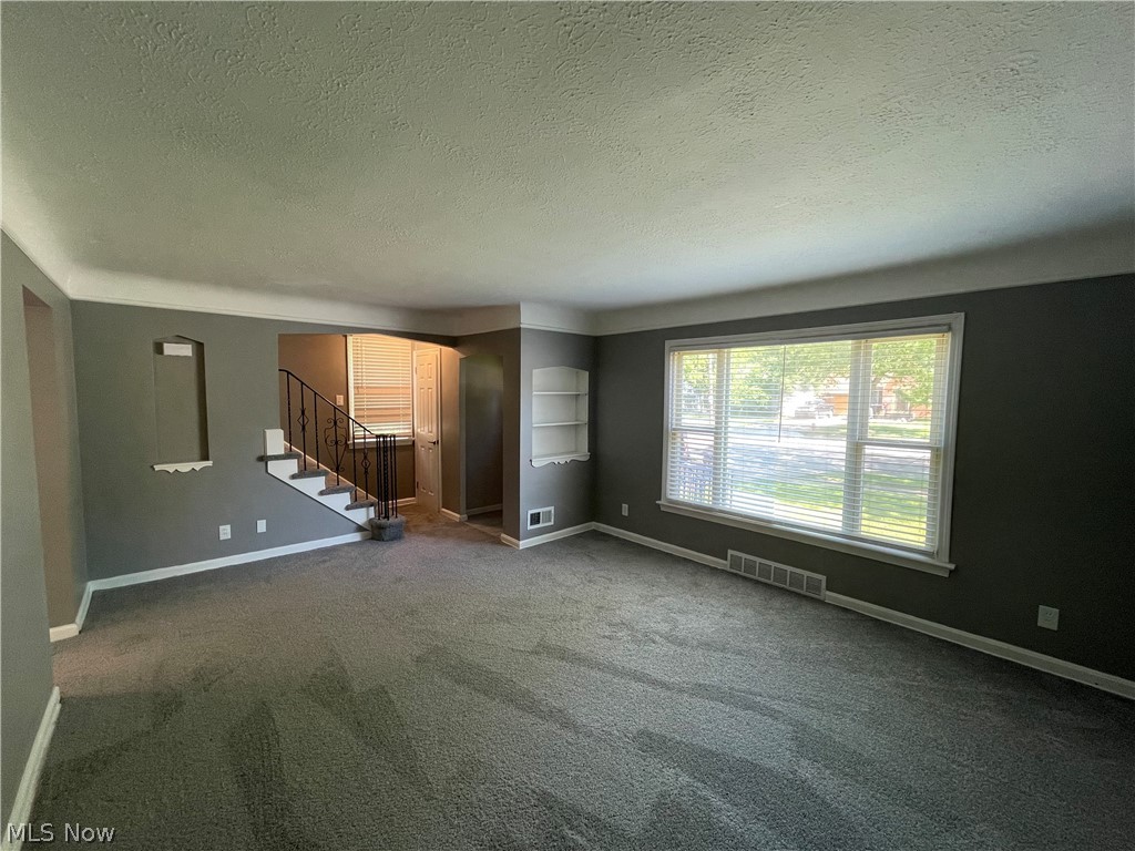 14516 Rockside Road Maple Heights, OH 44137 - Photo 3 of 30 living room with built-in bookcase