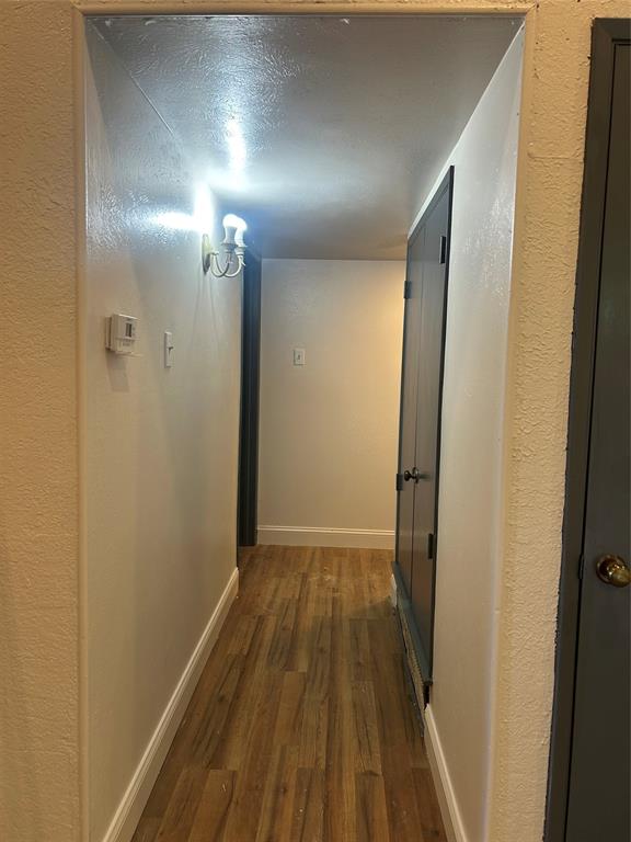 2043 Chestnut Road Carrollton, TX 75007 - Photo 15 of 19 a view of hallway with wooden floor